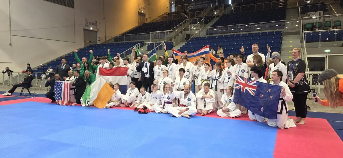 Athletes and instructors from IITA member nations together with their national flags