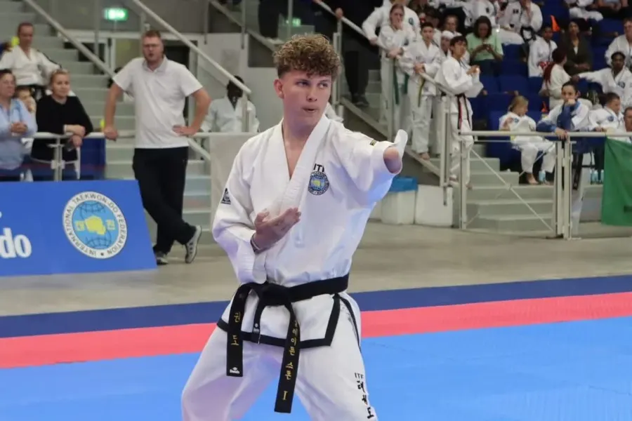Athlete performing a Taekwon-Do pattern at the World Championships